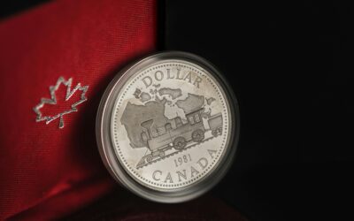 Detailed view of a 1981 Canadian silver dollar featuring a train design in an elegant case.