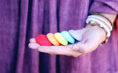 Vibrant rainbow cookies on an open hand symbolizing LGBT pride and diversity.